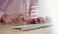 paperless concept. man typing on computer keyboard checking on electronic form documentation checklist