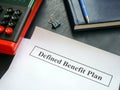 Papers with defined benefit plan and calculator. Royalty Free Stock Photo