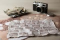 Papers with family tree templates, vintage camera and photos on light wooden table, closeup Royalty Free Stock Photo