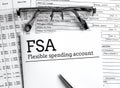 Papers with flexible spending account FSA on a table Royalty Free Stock Photo