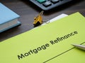 Papers with information about mortgage refinance on the table.