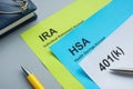 Papers about IRA, HSA and 401k plan on the desk. Royalty Free Stock Photo