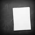 Papers is placed on a slightly angled dark chalkboard surface with Royalty Free Stock Photo