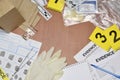 Paperwork during crime scene investigation process in csi laboratory. Evidence labels with fingerprint applicant and many Royalty Free Stock Photo