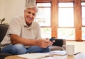 Paperwork, phone and senior man with pension plan, investments and savings on sofa. Happiness, banking and portrait of Royalty Free Stock Photo