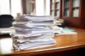 a paperwork pile marked unprocessed on a desk