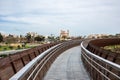 Paphos, Paphos District, Cyprus - Bending pedestrian footbridge through the ruins and nature landscape