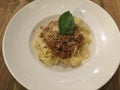 Pappardelle Bolognese dish, top view, white plate