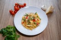 Pappardelle pasta italian with tomatoes, parmegiano reggiano cheese