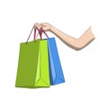 Papper shopping bags in woman`s hand