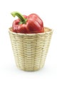 Paprika pepper in bamboo basket isolated white background Royalty Free Stock Photo
