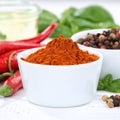 Paprika powder spicy red hot chili peppers chilli cooking ingredients square Royalty Free Stock Photo