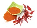Paprika powder in a woodden bowl with red hot chili and red sweet chili