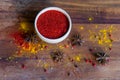 Paprika powder in wooden bowl with anise Royalty Free Stock Photo