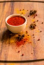 Paprika powder in wooden bowl with anise Royalty Free Stock Photo