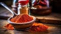 Paprika powder in a wooden bowl on a table Royalty Free Stock Photo