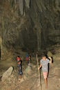 Papuan boys exploring lime stone cave Goa Jepang on Biak Island