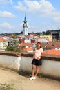 Papuan girl with City tower in Trebic behind