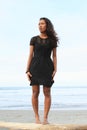 Papuan girl standing on beach