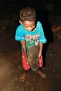 Papuan kid showing old artefact from World War Two in cave Goa Jepang on Biak Island