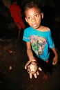 Papuan kid showing old iron artefact from World War Two in cave Goa Jepang on Biak Island