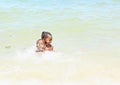 Papuan kids playing in sea