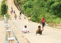 Papuan kids sledding on road