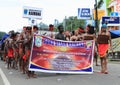 Papuan men in traditional clothes and face paintings from Kaimana