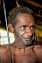Papuan oldman from Korowai tribe Royalty Free Stock Photo