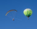 Para glider with engine flying in the high blue sky like a bird with balloon Royalty Free Stock Photo