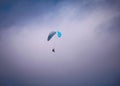 Para-glider flying through the sky