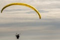 A para-glider up in the sky during a fly, surrounded by the clouds