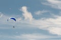 A para-glider up in the sky during a fly, surrounded by the clouds