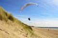 Para gliding above the dunes and coastline Royalty Free Stock Photo