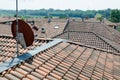 Antenna with parabola, on the roofs that transmits on various frequencies.