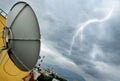 Parabolic antenna and lightning Royalty Free Stock Photo