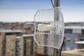 Parabolic grid antenna on apartment building 2 Royalty Free Stock Photo
