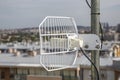 Parabolic grid antenna on apartment building 4 Royalty Free Stock Photo