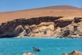 Paracas National Reserve, colorful sands, desert hills, in the center is a boat, Pisco, Peru 2019-12-05.