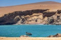 Paracas National Reserve, colorful sands, desert hills, in the center is a boat, Pisco, Peru 2019-12-05.