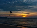 Parachute against the sunset against the sea, Batu Ferringhi beach, Penang, Malaysia, Copy space Royalty Free Stock Photo