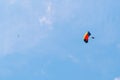 Parachute and airplane with blue sky on the background