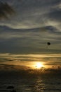 Parachute. Free flight. Sunset at sea