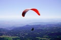 Parachute paragliding in sky Puy de Dome blue sky in French Massif Central France