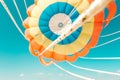 Parachute parasailing of tourists on a sandy beach Sunny weather against the background of clear sea and ocean.The wind blows up Royalty Free Stock Photo