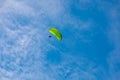 parachute in the sky. A tandem of two parachutists flies on a parachute in the blue sky Royalty Free Stock Photo