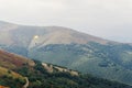 Parachute skydiver flying in clouds at top of mountains with ama