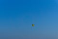 Parachutes flying in the distance over the blue sky Royalty Free Stock Photo