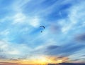 Parachuting blue sky at sunset white clouds  Paragliding  high  flying over the sea with blue water landscape nature background Royalty Free Stock Photo