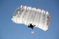 Parachutist on blue sky Royalty Free Stock Photo